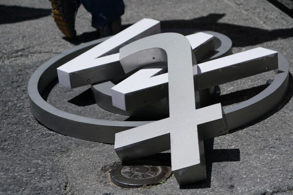A pile of characters removed from a sign on the Twitter headquarters building are seen in San Francisco, Monday, July 24, 2023. Elon Musk has unveiled a new 
