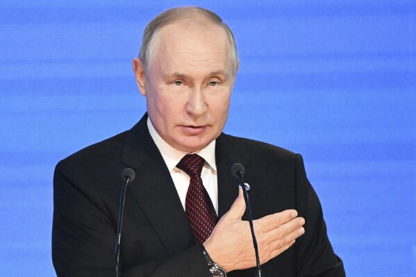 Russian President Vladimir Putin gestures while addressing the annual meeting of the Valdai Discussion Club in the Black Sea resort of Sochi, Russia, Thursday, Oct. 5, 2023. (Sergei Guneyev, Sputnik, Kremlin Pool Photo via AP)