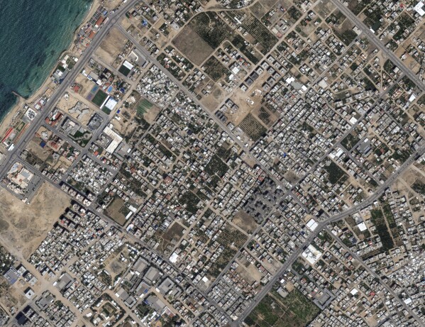 This image provided by Maxar Technologies shows before bombing at Al Karameh neighborhood, northern Gaza, on May 10, 2023. (Satellite image ©2023 Maxar Technologies via AP)
