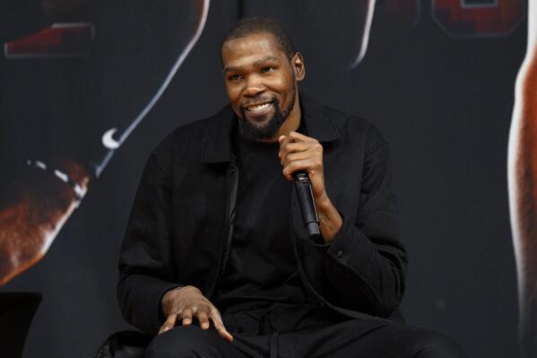 Phoenix Suns forward Kevin Durant, speaks to the media after being introduced during an NBA basketball team availability, Thursday, Feb. 16, 2023, in Phoenix. (AP Photo/Matt York)