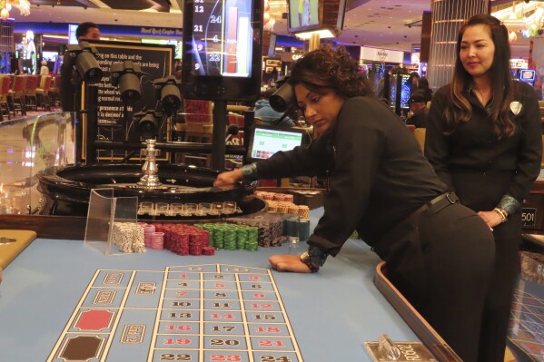 Dealers conduct a game of roulette at the Hard Rock casino in Atlantic City, N.J., on May 17, 2023. Figures released by state gambling regulators on Thursday, May 16, 2024, show that New Jersey's casinos, horse tracks that accept sports bets and their online partners won more than half a billion dollars from gamblers in April, an increase of 10.4% from a year earlier. (AP Photo/Wayne Parry)