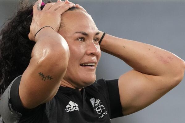 New Zealand's Portia Woodman reacts as her team celebrates defeating France in the women's rugby gold medal match at the 2020 Summer Olympics, Saturday, July 31, 2021 in Tokyo, Japan. (AP Photo/Shuji Kajiyama)