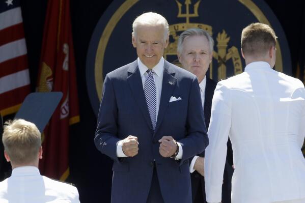 FILE - Vice President Joe Biden gestures as he greets graduating members of the U.S. Naval Academy at the Academy's graduation and commissioning ceremony, Friday, May 22, 2015, in Annapolis, Md.   Biden is scheduled to speak at the U.S. Naval Academy’s graduation and commissioning ceremony next month. The academy announced Thursday, April 28, 2022,  that the ceremony for the Class of 2022 is scheduled for May 27 at the Navy-Marine Corps Memorial Stadium in Annapolis.  (AP Photo/Patrick Semansky, File)