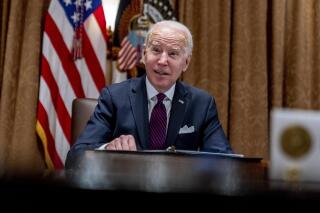 President Joe Biden meets with members of the Infrastructure Implementation Task Force to discuss the Bipartisan Infrastructure Law, in the Cabinet Room at the White House in Washington, Thursday, Jan. 20, 2022. The Biden administration is announcing policy changes to attract international students specializing in science, technology, engineering and math. It's part of the broader effort to make the U.S. economy more competitive. (AP Photo/Andrew Harnik)