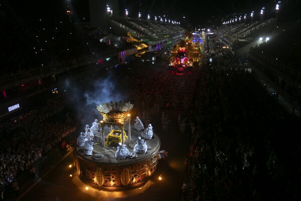 Performers from the Unidos de Padre Miguel samba school dance during Carnival celebrations at the Sambadrome in Rio de Janeiro, Sunday, March 2, 2025. (AP Photo/Bruna Prado)