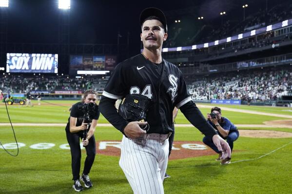 Chicago White Sox starting pitcher Dylan Cease looks to fans as he leaves the field after the White Sox defeated the Minnesota Twins in a baseball game in Chicago, Saturday, Sept. 3, 2022. (AP Photo/Nam Y. Huh)