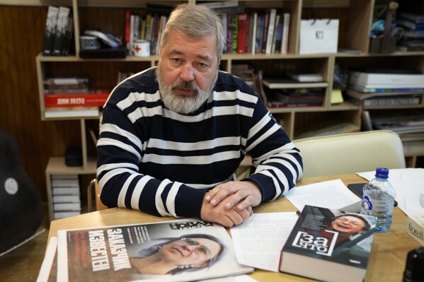 FILE - Novaya Gazeta editor Dmitry Muratov speaks during an interview with The Associated Press at the Novaya Gazeta newspaper, in Moscow, Russia, on Oct. 7, 2021. A lawyer for a man convicted in the 2006 killing of Russian investigative journalist Anna Politkovskaya received a presidential pardon after a stint fighting in Ukraine. Sergei Khadzhikurbanov was sentenced to 20 years in prison in 2014 for his role in the death of Politkovskaya. Dmitry Muratov and Politkovskaya's children, Vera and Ilya, condemned Khadzhikurbanov's release. (AP Photo/Alexander Zemlianichenko, File)