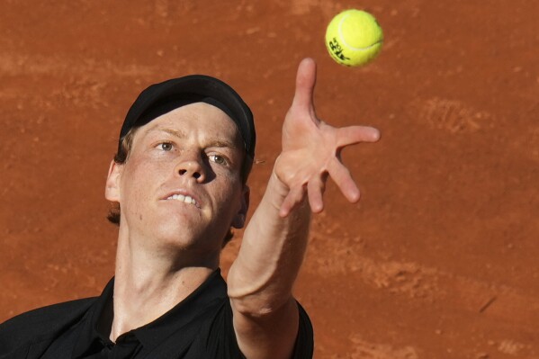 Italy's Jannik Sinner serves the ball to Netherlands' Jesper De Jong during their tennis match at the Italian Open at the Foro Italico, in Rome, Monday, May 12, 2025. (AP Photo/Alessandra Tarantino)