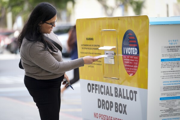 A ballot is dropped off on Election Day at the Registrar of Voters office, Tuesday, March 5, 2024, in Norwalk, Calif. (AP Photo/Marcio Jose Sanchez)