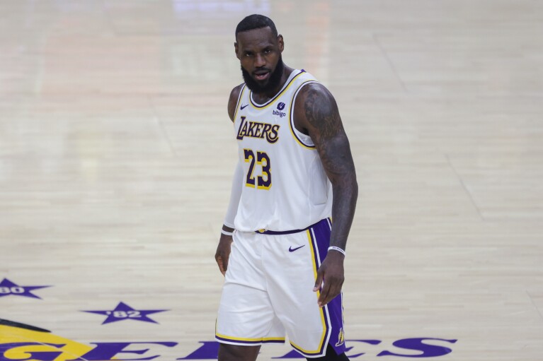 Los Angeles Lakers forward LeBron James stands on the court during the second half of the team's NBA basketball game against the Denver Nuggets, Saturday, March 2, 2024, in Los Angeles. (AP Photo/Yannick Peterhans)