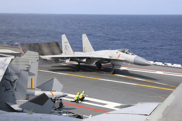 FILE -In this photo released by Xinhua News Agency, a J-15 Chinese fighter jet prepares to take off from the Shandong aircraft carrier during the combat readiness patrol and military exercises around the Taiwan Island by the Eastern Theater Command of the Chinese People's Liberation Army (PLA) on Sunday, April 9, 2023. Weeks before Taiwan holds elections for its president and legislature, China has renewed its threat to use military force to annex the self-governing island democracy it claims as its own territory. (An Ni/Xinhua via AP, File)