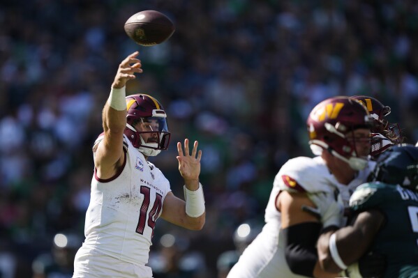 Washington Commanders quarterback Sam Howell (14) throws during the second half of an NFL football game against the Philadelphia Eagles on Sunday, Oct. 1, 2023, in Philadelphia. (AP Photo/Matt Rourke)