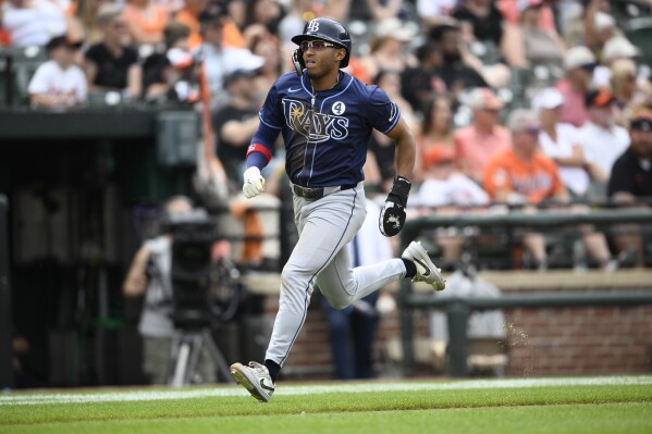 Tampa Bay Rays' Richie Palacios runs towards home to score on a double by Jose Siri during the eighth inning of a baseball game against the Baltimore Orioles, Sunday, June 2, 2024, in Baltimore. (AP Photo/Nick Wass)