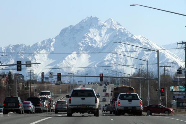 This April 14, 2022, photo shows traffic moving through Wasilla, Alaska, which is located about 45 miles north of Anchorage, a region that is a conservative hotbed in the state. The town's de facto main street is the busy four-lane Parks Highway, the main thoroughfare between Anchorage and Fairbanks. (AP Photo/Mark Thiessen)