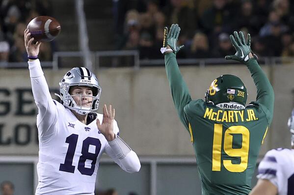 Kansas State quarterback Will Howard (18) pass over Baylor cornerback AJ McCarty (19) in the second half of an NCAA college football game, Saturday, Nov. 12, 2022, in Waco, Texas. (AP Photo/Jerry Larson)