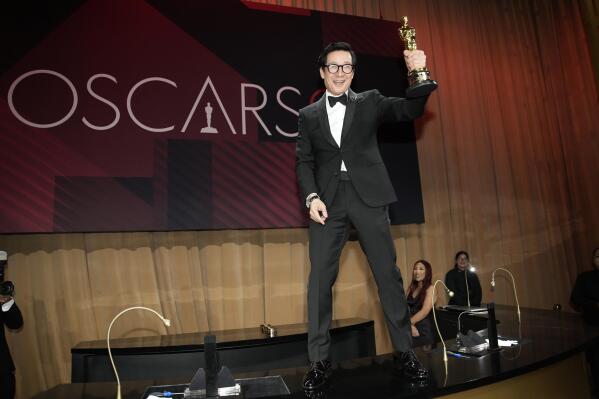 Ke Huy Quan poses with his award for best performance by an actor in a supporting role for "Everything Everywhere All at Once" at the Governors Ball after the Oscars on Sunday, March 12, 2023, at the Dolby Theatre in Los Angeles. (AP Photo/John Locher)