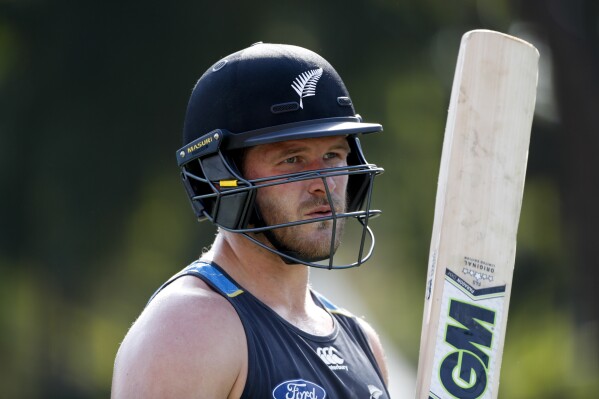 FILE - New Zealand's Corey Anderson bats during a practice session ahead of their second one-day international cricket match against India in New Delhi, India, on Oct. 19, 2016. (AP Photo/Tsering Topgyal, File)