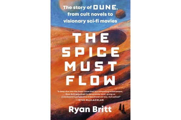 This cover image released by Plume shows "The Spice Must Flow: The Story of Dune from Cult Novels to Visionary Sci-fi Movies" by Ryann Britt. (Plume via AP)