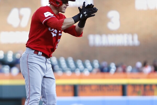 Cincinnati Reds' TJ Friedl celebrates his two-run triple against the Detroit Tigers during the second inning of a baseball game Wednesday, Sept. 13, 2023, in Detroit. (AP Photo/Duane Burleson)