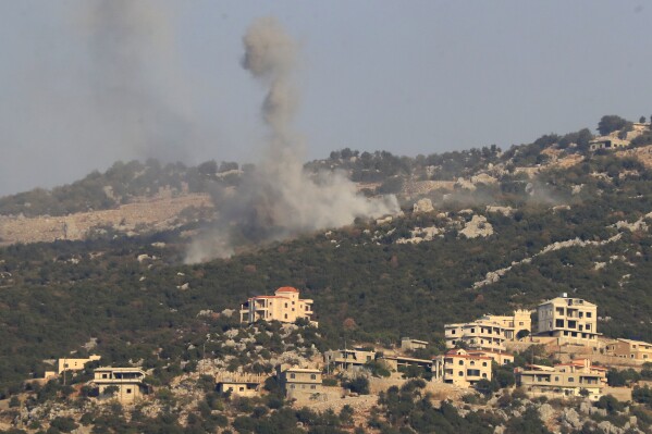Smoke rises from Israeli shelling on the outskirts of the Lebanese village of Kfar Chouba, Lebanon, Saturday, Oct. 14, 2023. The shelling occurred during an exchange of fire along Lebanon's border with Syria's Israeli-occupied Golan Heights between Hezbollah fighters and Israeli troops. (AP Photo/Mohammed Zaatari)