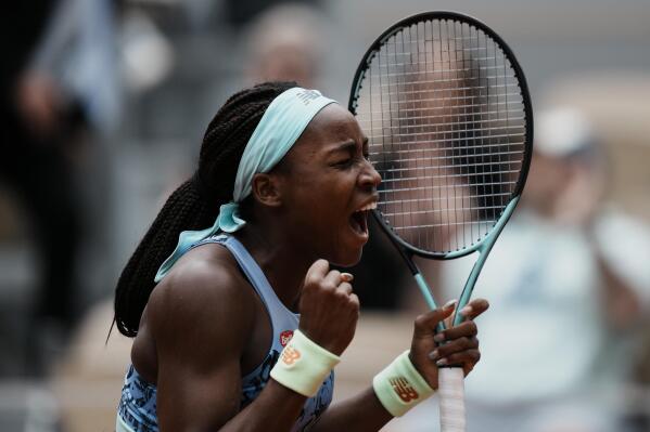 Coco Gauff of the U.S. celebrates winning against Belgium's Elise Mertens in two sets, 6-4, 6-0, during their fourth round match at the French Open tennis tournament in Roland Garros stadium in Paris, France, Sunday, May 29, 2022. (AP Photo/Thibault Camus)