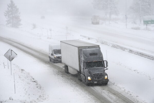 Westbound traffic moves slowly on I-80 at the Donner Pass exit on March 1, 2024 in Truckee, California.  The most powerful Pacific storm of the season is forecast to bring up to 10 feet of snow to the Sierra Nevada.  By the end of the week.  (AP Photo/Andy Baron)