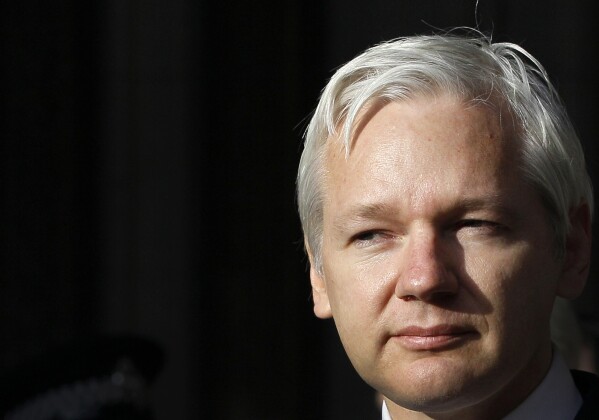 FILE - WikiLeaks founder Julian Assange pauses as he makes a statement to the media gathered outside the High Court in London, Dec. 5, 2011. WikiLeaks founder Julian Assange is facing what could be his final court hearing in England over whether he should be extradited to the United States to face spying charges. The High Court will hear two days of arguments next week over whether Assange can make his pitch to an appeals court to block his transfer to the U.S. (AP Photo/Kirsty Wigglesworth, File)