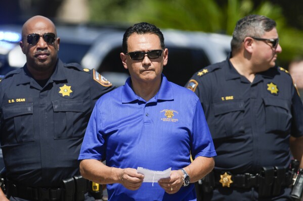 Harris County Sheriff Sheriff Ed Gonzalez walks to a press conference as deputies respond to a scene of a shooting, Sunday, Oct. 1, 2023, in Houston. Gonzalez says deputies responded to the shootings in northwest Houston Sunday morning and found multiple gunshot victims. (Jason Fochtman/Houston Chronicle via AP)