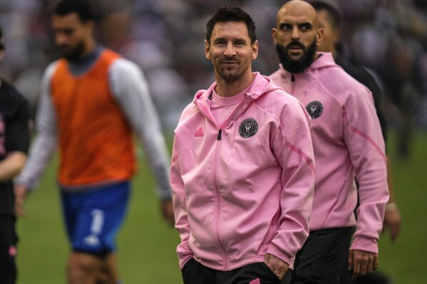 FILE - Inter Miami's Lionel Messi, center, looks on after the first half of the friendly football match between Hong Kong Team and US Inter Miami CF at the Hong Kong Stadium in Hong Kong, Sunday, Feb. 4, 2024. Inter Miami's global tour of exhibition games, thought they are about promotion and marketing, hope to build a new brand by using stars like Messi and Uruguayan Luis Suarez. Instead, the tour is getting mostly bad PR and results that have not been much better. (AP Photo/Louise Delmotte, File)