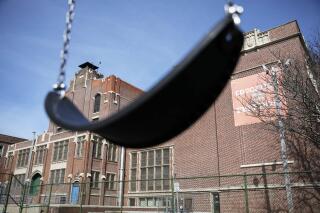FILE - A swing sits empty on a playground outside in Providence, R.I., March 7, 2020. Columbia University’s Center on Poverty and Social Policy estimates that the number of children in poverty grew by 3.7 million from December 2021 to January 2022, a 41% increase, just one month without the expanded child tax credit payments. (AP Photo/David Goldman, File)