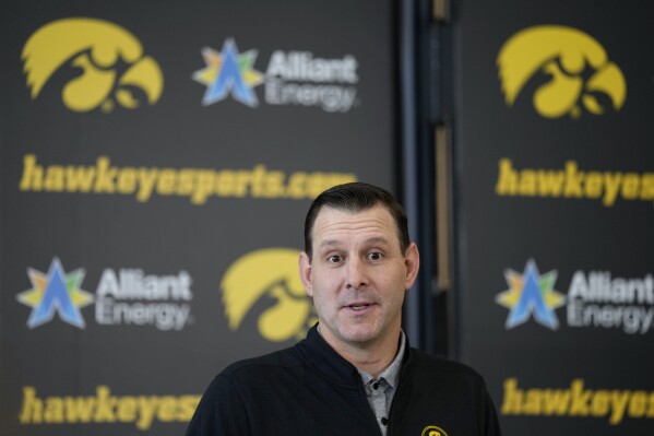 New Iowa offensive coordinator Tim Lester speaks during an NCAA college football news conference, Tuesday, Feb. 6, 2024, in Iowa City, Iowa. (AP Photo/Charlie Neibergall)
