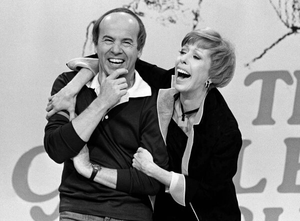 REMOVES REFERENCE TO HULU - FILE - Carol Burnett, right, shares a laugh with Tim Conway during a taping of her final show on March 19, 1978, in Los Angeles. Episodes of "The Carol Burnett Show" are available on streaming services like Tubi and The Roku Channel.  (AP Photo/ George Brich, File)