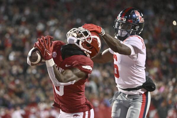 Arkansas wide receiver Matt Landers (3) makes a touchdown catch in front of Mississippi defensive back Miles Battle (6) during the first half of an NCAA college football game Saturday, Nov. 19, 2022, in Fayetteville, Ark. (AP Photo/Michael Woods)