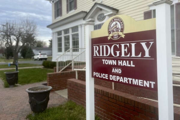 The sign outside the town government and police department offices stands in Ridgely, Md., Friday, March 15, 2024. Ridgely officials announced last week that their entire police department had been suspended pending the results of an investigation by state prosecutors. (AP Photo/Lea Skene)