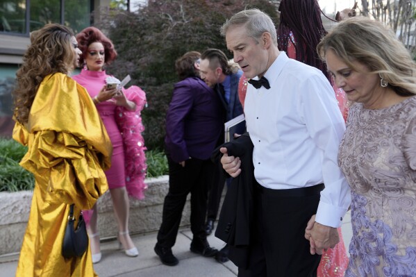 Rep. Jim Jordan, R-Ohio, and Polly Jordan walk past Tara Hoot, Ricky Rosé, Vagenesis and Maria Con Carne outside the Kennedy Center, to attend Les Miserables, Wednesday, June 11, 2025, in Washington, on the night that President Donald Trump and first lady Melania Trump were also attending. (AP Photo/Julia Demaree Nikhinson)