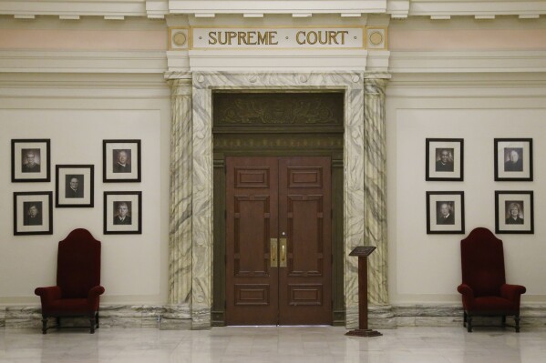 FILE - The Oklahoma Supreme Court is pictured in the state Capitol building in Oklahoma City, May 19, 2014. The Oklahoma Supreme Court on Wednesday, June 12, 2024, dismissed a lawsuit of the last two survivors of the 1921 Tulsa Race Massacre, dampening the hope of advocates for racial justice that the government would make amends for one of the worst single acts of violence against Black people in U.S. history. (AP Photo/Sue Ogrocki, File)