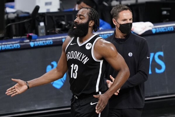 Brooklyn Nets guard James Harden celebrates with coach Steve Nash, right, during the second half of the team's NBA basketball game against the Detroit Pistons, Saturday, March 13, 2021, in New York. (AP Photo/John Minchillo)