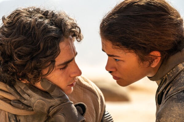 This image released by Warner Bros. Pictures shows Timothee Chalamet, left, and Zendaya in a scene from "Dune: Part Two." (Niko Tavernise/Warner Bros. Pictures via AP)