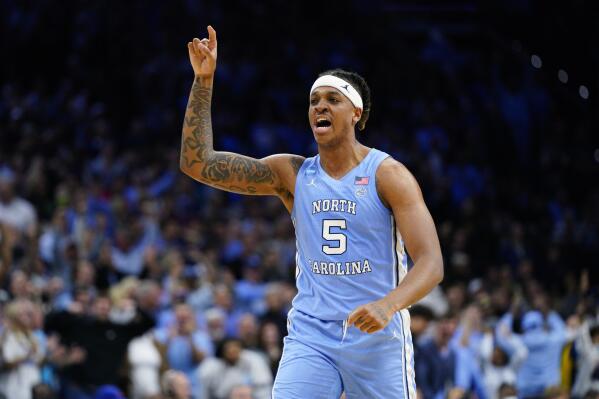 FILE - North Carolina's Armando Bacot reacts during the second half of the team's game against UCLA in the NCAA men's college basketball tournament March 25, 2022, in Philadelphia. The 6-foot-11, 235-pound Bacot led the team last season in scoring, rebounding, shooting percentage and blocks. He is the preseason pick for ACC player of the year for the league favorite Tar Heels.(AP Photo/Chris Szagola, File)