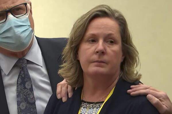 FILE - In this screen grab from video, former Brooklyn Center Police Officer Kim Potter stands with defense attorney Earl Gray, as the verdict is read Dec.,23, 2021 at the Hennepin County Courthouse in Minneapolis. Prosecutors say Potter, the former suburban Minneapolis police officer who was convicted of manslaughter in the killing of Daunte Wright should face a sentence above the state's guidelines. But defense attorneys for Kim Potter say she should get a lower sentence — or even probation. (Court TV via AP, Pool, File)