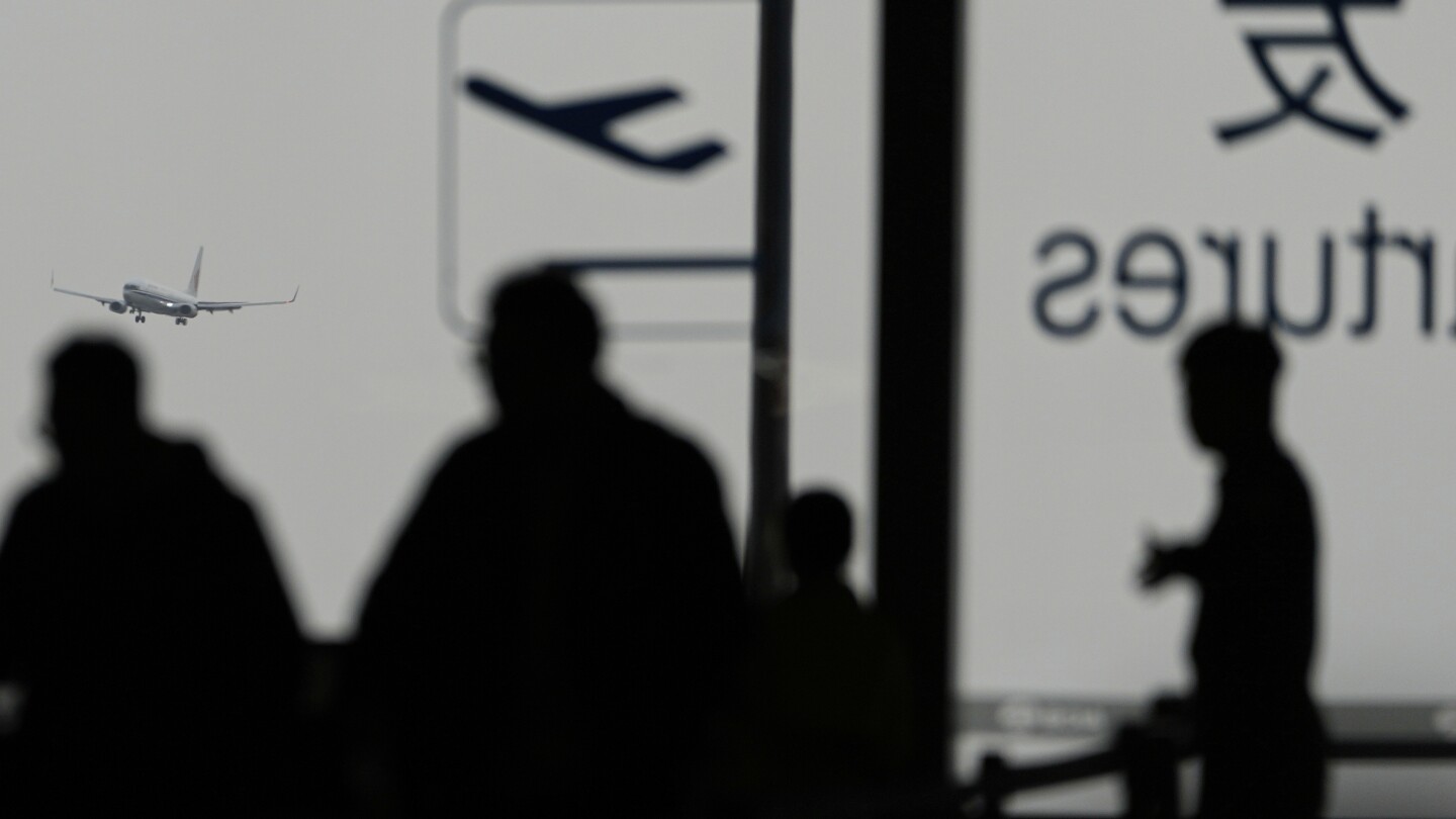 High winds and sandstorms prompt Beijing to cancel hundreds of flights and close parks
