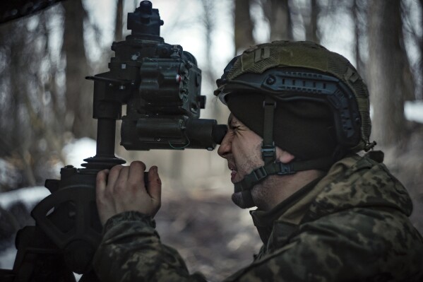 A Ukrainian serviceman prepares to fire a M777 howitzer towards Russian positions at the frontline near Donetsk, Ukraine, Monday, March 3, 2025. (AP Photo/Roman Chop)