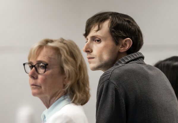 Logan Clegg, right, and defense attorney Caroline Smith, look over at the jury as they are polled at Merrimack County Superior Court in Concord, N.H. on Monday, October 23, 2023 . After deliberating for a day and a half, a jury found Clegg guilty of second-degree murder in the April 2022 killings of Stephen and Djeswende Reid. (Geoff Forester/The Concord Monitor via AP, Pool)