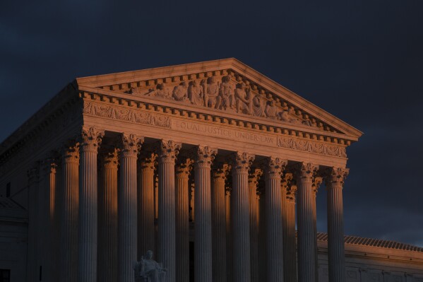 FILE - The Supreme Court is seen at sunset in Washington, on Jan. 24, 2019. The Supreme Court will be taking its first look in the 156-year history of the 14th Amendment at a provision, Section 3, that's meant to keep former officeholders who "engaged in insurrection" from ever regaining power. The stakes couldn't be higher in arguments taking place on Thursday, Feb. 8, 2024. (AP Photo/J. Scott Applewhite, File)