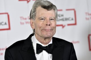 FILE - In this Tuesday, May 22, 2018, file photo, PEN literary service award recipient Stephen King attends the 2018 PEN Literary Gala in New York. Readers may know him best for “Carrie,” “The Shining” and other bestsellers commonly identified as “horror,” but King has long had an affinity for other kinds of narratives, from science fiction and prison drama to the Boston Red Sox.  (Photo by Evan Agostini/Invision/AP, File)