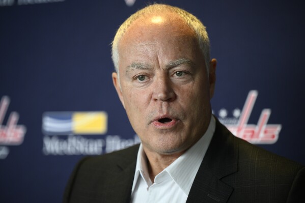 FILE - Washington Capitals senior vice president and general manager Brian MacLellan talks to the media during media day at an NHL hockey training camp, Thursday, Sept. 22, 2022, in Arlington, Va. The Washington Capitals have promoted Brian MacLellan to president of hockey operations to go along with his general manager duties. MacLellan had been the team's vice president and GM. (AP Photo/Nick Wass, File)