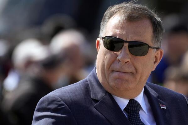 FILE - Bosnian Serb member of the tripartite Presidency of Bosnia Milorad Dodik watches military exercises on Batajnica, military airport near Belgrade, Serbia, Saturday, April 30, 2022. The leader of Bosnian Serbs said Sunday, June 26, 2022 he hoped Donald Trump would return to power in the United States and that the Serbs will "wait for appropriate global circumstances" in order to reach their goal secede from Bosnia which he said is an "unsustainable state." (AP Photo/Darko Vojinovic, File)