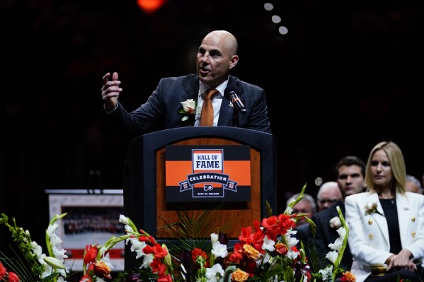 Rick Tocchet speaks during his induction ceremony into the Philadelphia Flyers' Hall of Fame before an NHL hockey game between the Flyers and the Calgary Flames, Tuesday, Nov. 16, 2021, in Philadelphia. (AP Photo/Matt Slocum, file)