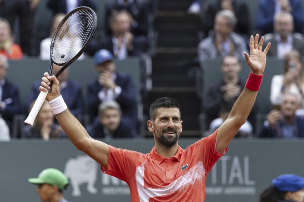 Serbia's Novak Djokovic celebrates after winning a game against Hungary's Marton Fucsovics, during the round of 16 match at the ATP 250 Geneva Open Tennis Tournament, in Geneva, Switzerland, Wednesday, May 21, 2025 (Cyril Zingaro/Keystone via AP)