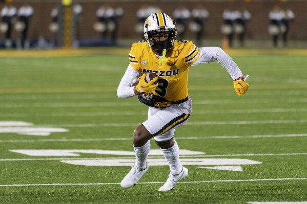 FILE - Missouri wide receiver Luther Burden III runs after a catch during the first quarter of an NCAA college football game against New Mexico State Saturday, Nov. 19, 2022, in Columbia, Mo. Missouri opens their season at home against South Dakota on Aug. 31. (AP Photo/L.G. Patterson, File)